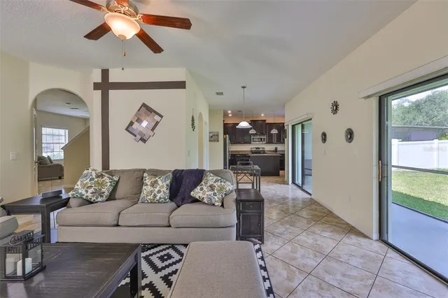 a kitchen with kitchen island granite countertop wooden cabinets stainless steel appliances and a counter space