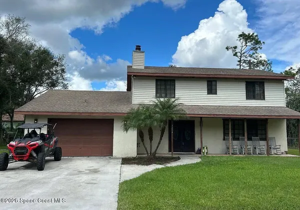 front view of a house with a yard