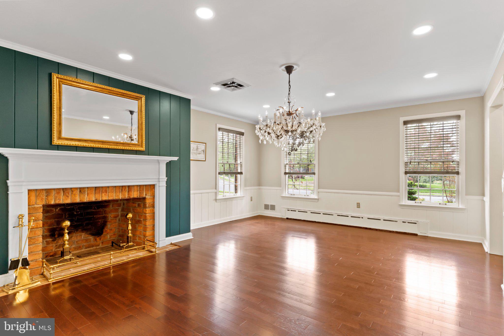 115 Kenwood Road Chambersburg, PA 17201 - Photo 12 of 74 a view of an empty room with wooden floor and a fireplace