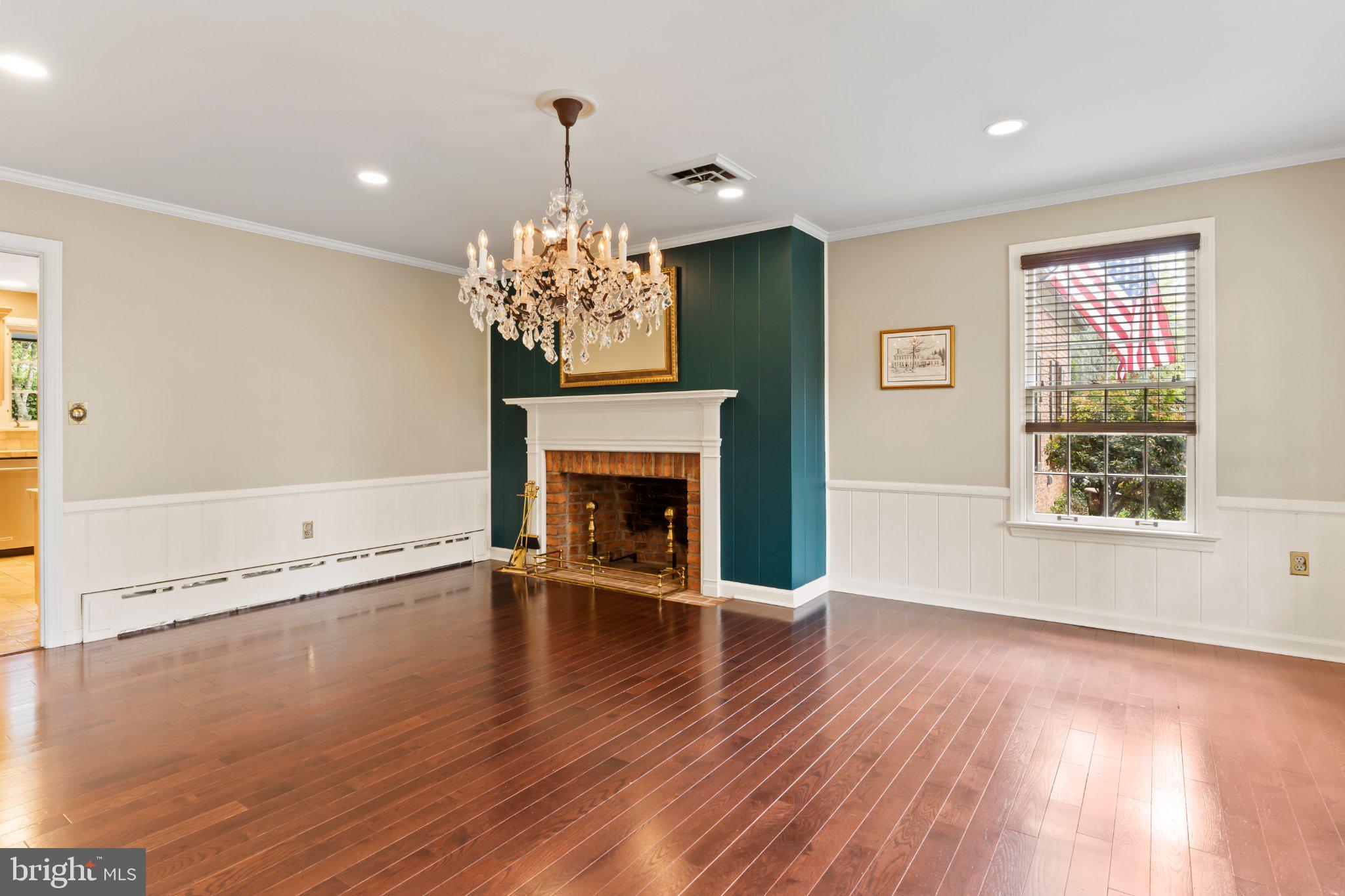 115 Kenwood Road Chambersburg, PA 17201 - Photo 14 of 74 a view of an empty room with wooden floor and a window