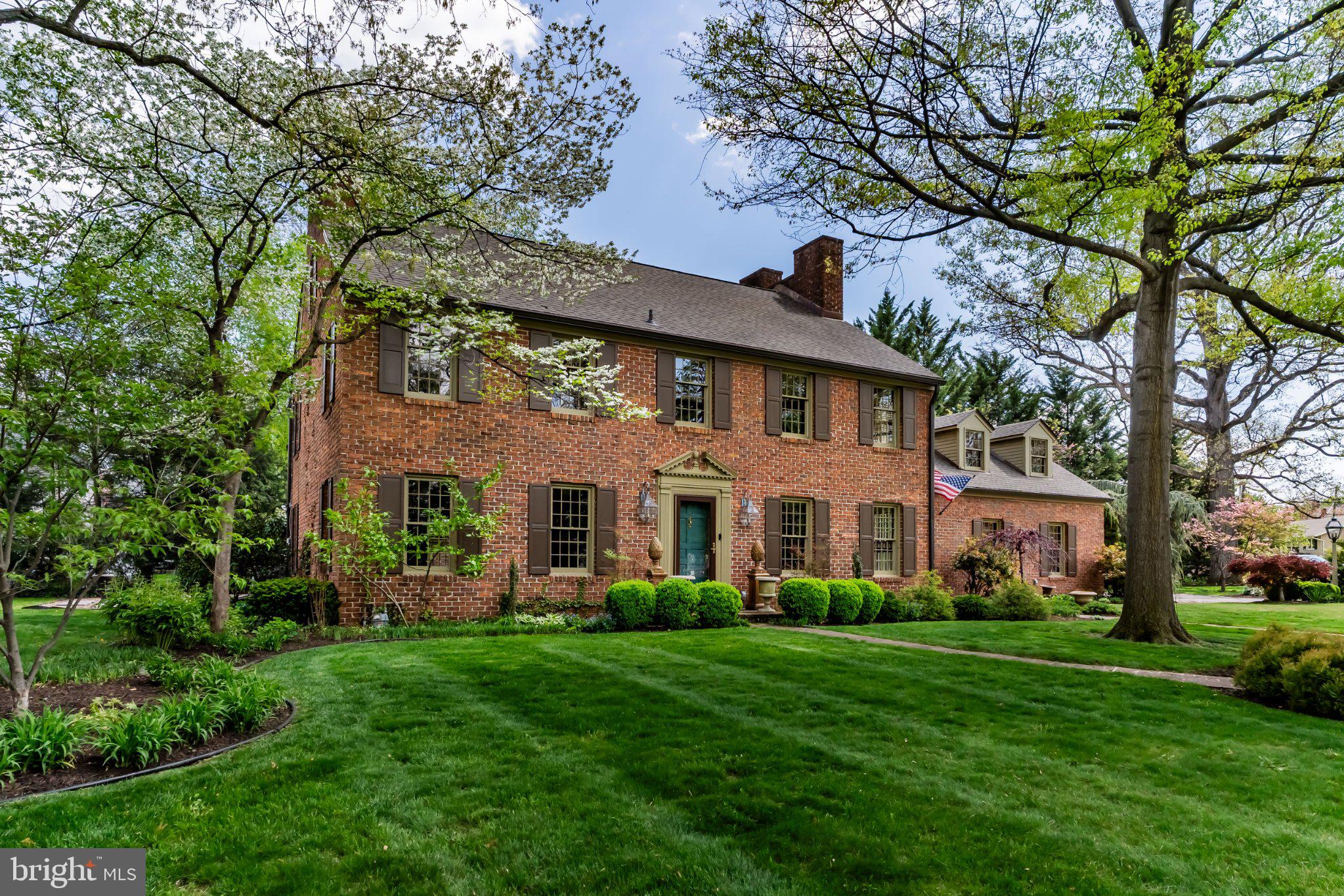115 Kenwood Road Chambersburg, PA 17201 - Photo 2 of 74 a front view of a house with a garden and trees