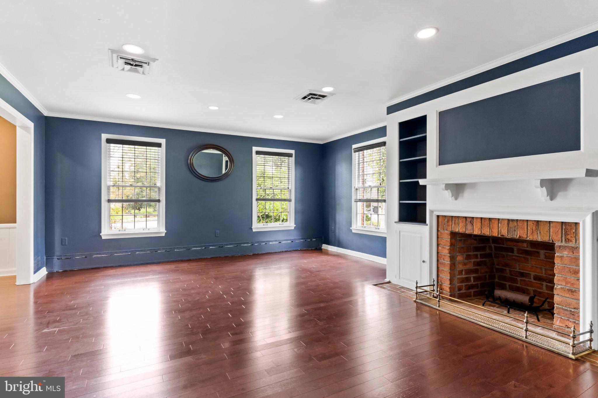 115 Kenwood Road Chambersburg, PA 17201 - Photo 22 of 74 a view of a livingroom with a fireplace and window
