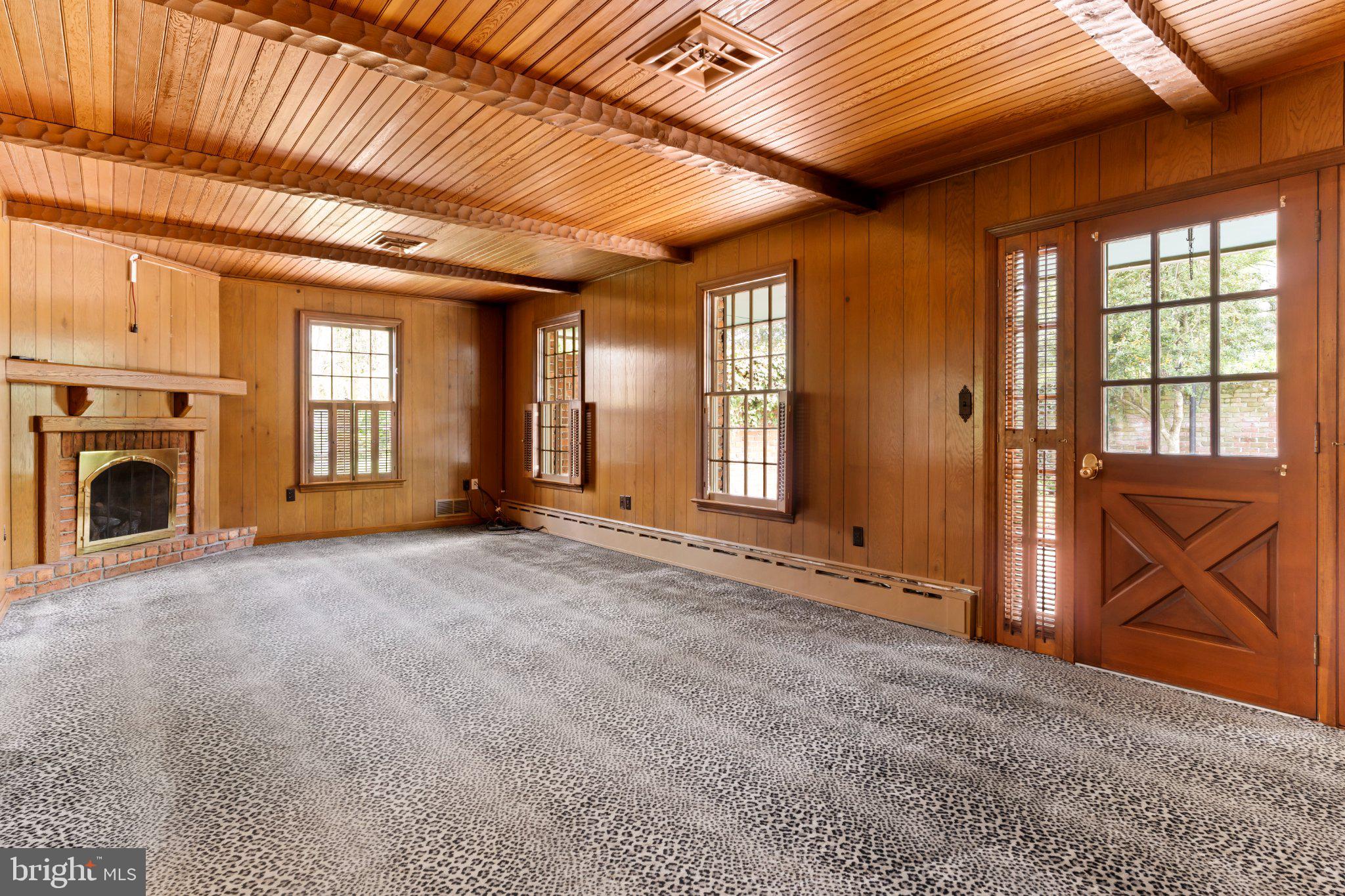 115 Kenwood Road Chambersburg, PA 17201 - Photo 28 of 74 a view of an empty room with a fireplace and a window