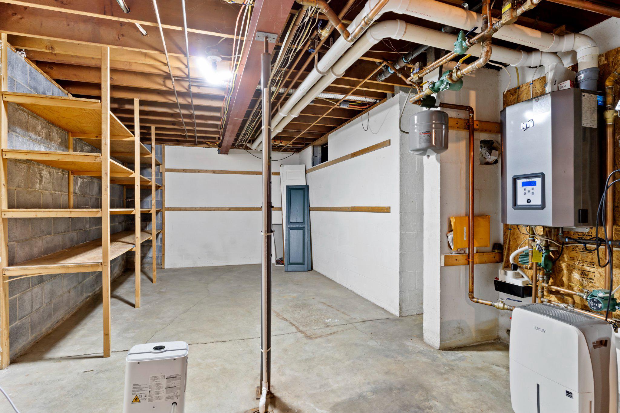 115 Kenwood Road Chambersburg, PA 17201 - Photo 65 of 74 a view of a storage room with an empty shelves