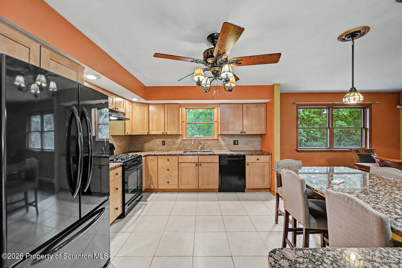 211 Buckingham Street Moscow, PA 18444 - Photo 28 of 83 a kitchen with a stove a sink and a refrigerator