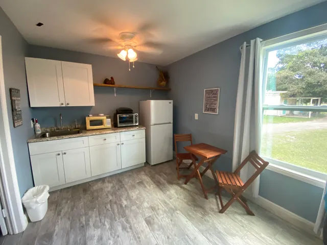 a kitchen with a sink appliances and cabinets