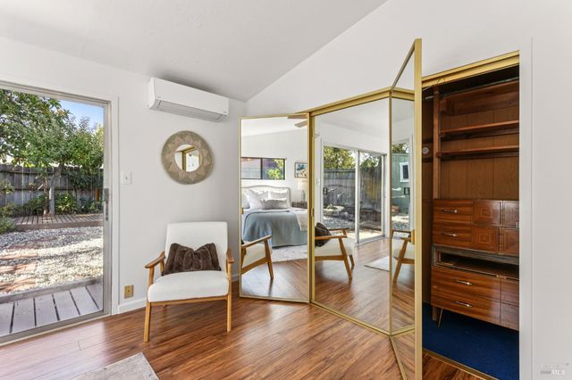 a bathroom with a granite countertop sink a toilet and a mirror