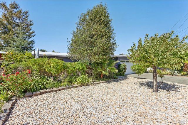 a backyard of a house with lots of green space