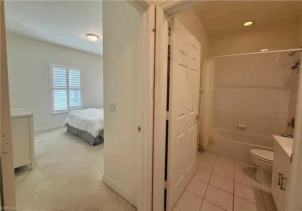 a spacious bathroom with a shower and a tub