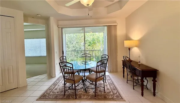 a view of a dining room with furniture window and outside view
