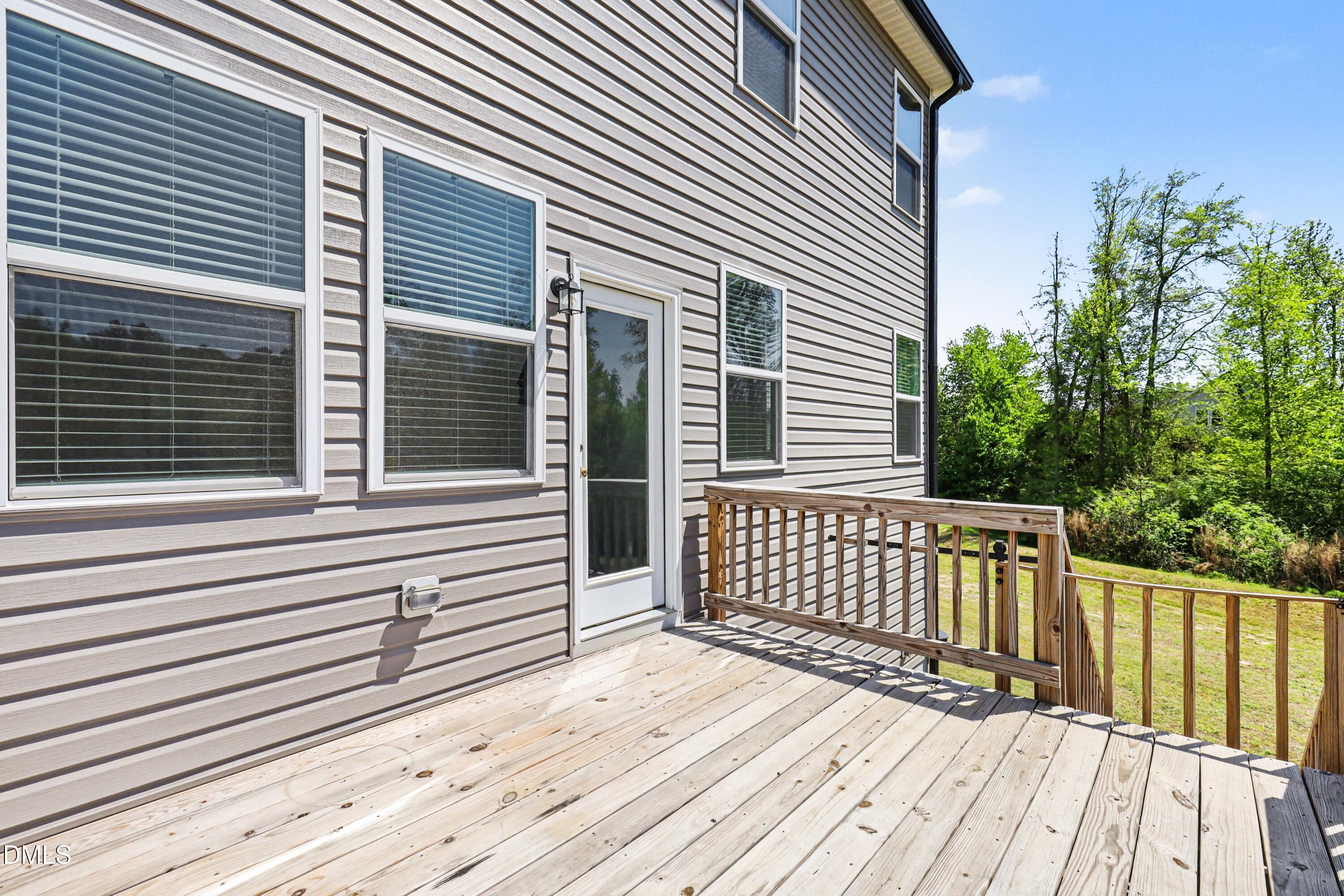 90 Rigsby Avenue Four Oaks, NC 27524 - Photo 37 of 43 a view of a wooden deck
