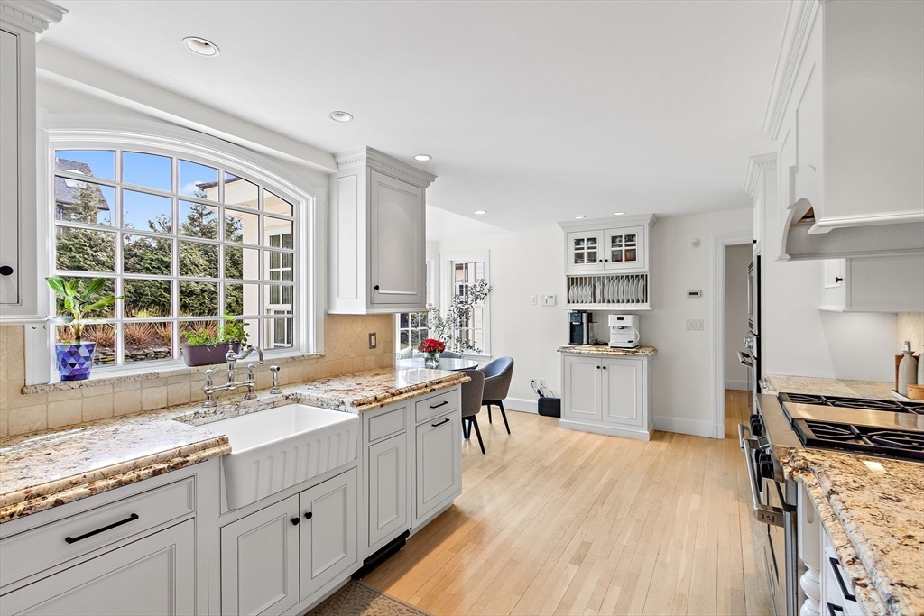 32 Pickwick Road Newton, MA 02465 - Photo 12 of 42 a kitchen with a sink stove and cabinets