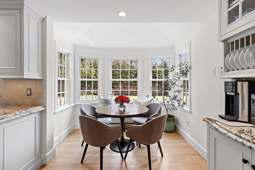 32 Pickwick Road Newton, MA 02465 - Photo 13 of 42 a dining room with furniture a rug and wooden floor