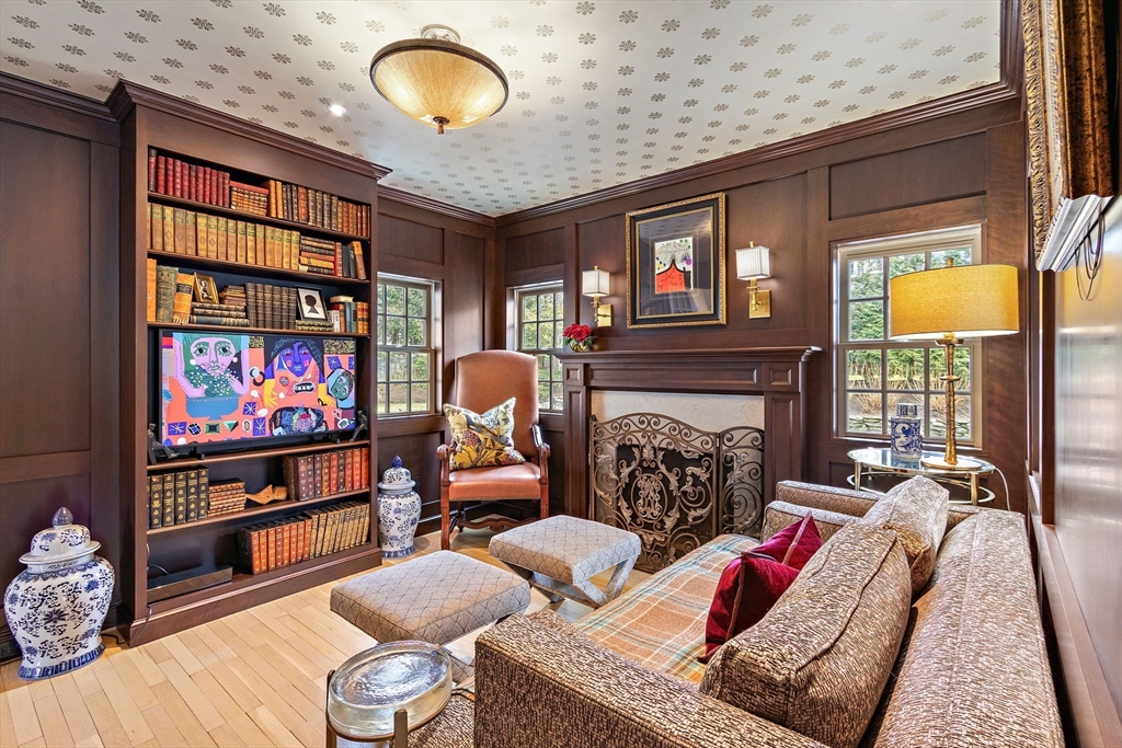 32 Pickwick Road Newton, MA 02465 - Photo 18 of 42 a living room with furniture a fireplace and a flat screen tv