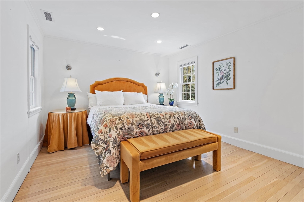 32 Pickwick Road Newton, MA 02465 - Photo 27 of 42 a bedroom with a bed and wooden floor