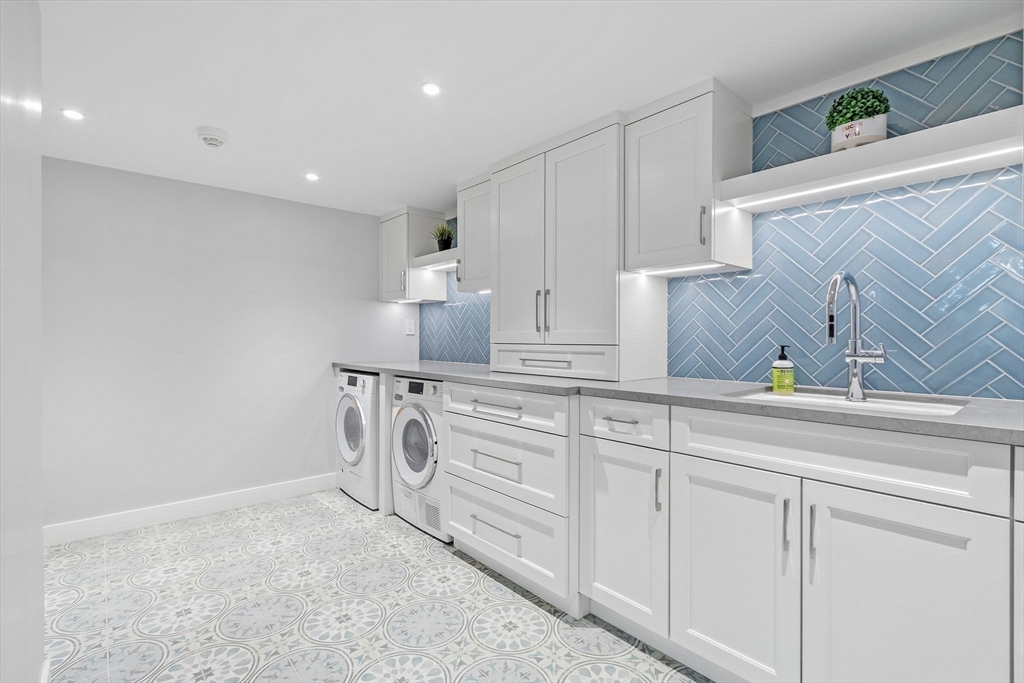 32 Pickwick Road Newton, MA 02465 - Photo 36 of 42 a kitchen with white cabinets and sink