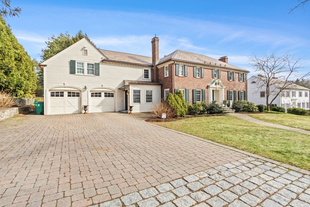 32 Pickwick Road Newton, MA 02465 - Photo 39 of 42 a front view of a building with a yard
