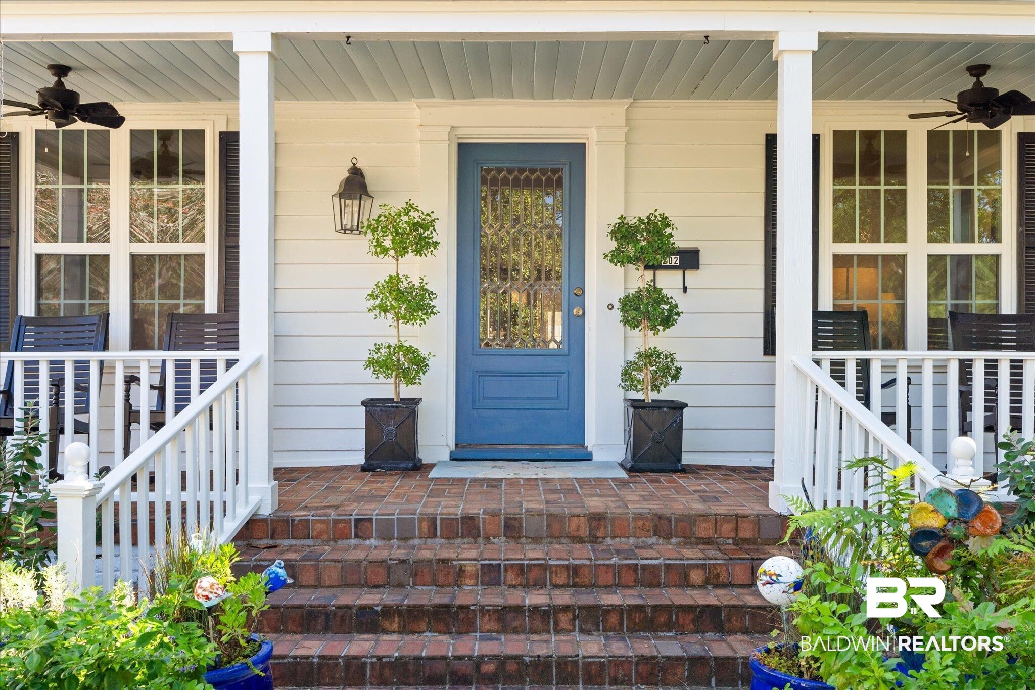 202 Woodlands Avenue Mobile, AL 36607 - Photo 2 of 53 Property entrance featuring covered porch and ceiling fan