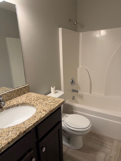 1110 Ransom Way Nashville, TN 37217 - Photo 19 of 26 a bathroom with a granite countertop sink a toilet and shower