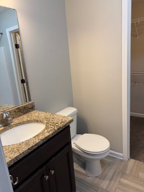 1110 Ransom Way Nashville, TN 37217 - Photo 23 of 26 a bathroom with a granite countertop toilet sink and mirror