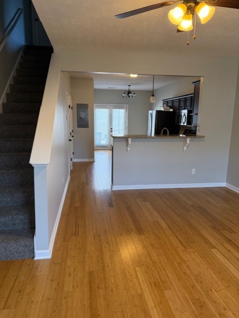 1110 Ransom Way Nashville, TN 37217 - Photo 26 of 26 a view of a living room and kitchen with furniture wooden floor and window
