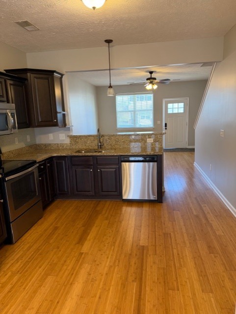 1110 Ransom Way Nashville, TN 37217 - Photo 7 of 26 a large kitchen with wooden floor