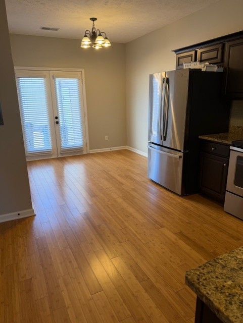 1110 Ransom Way Nashville, TN 37217 - Photo 9 of 26 a view of a kitchen with wooden floor and refrigerator