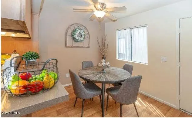 a dining room with furniture and window