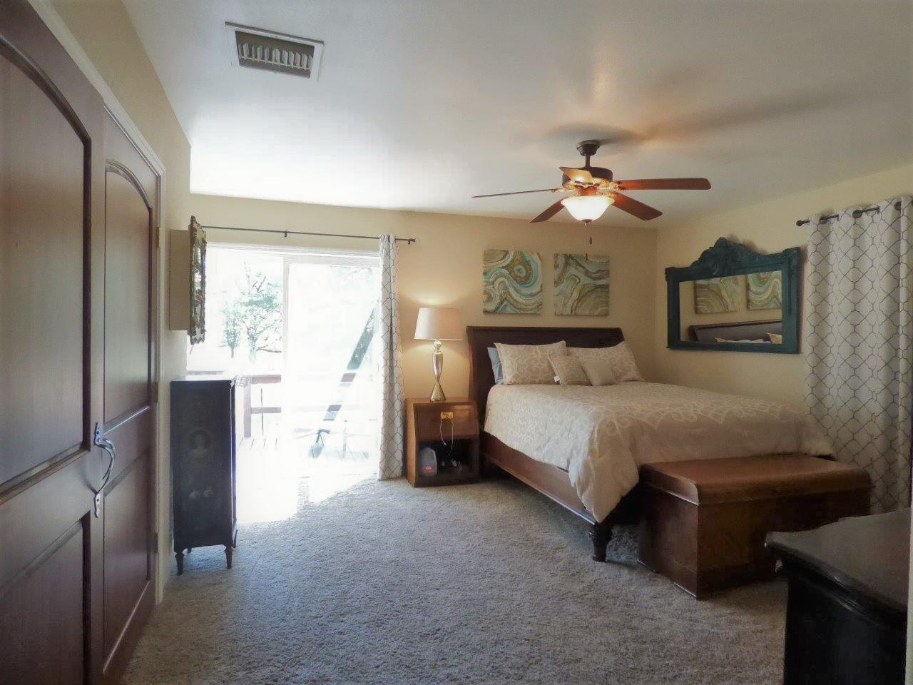 2104 Pine Grove Road Rogue River, OR 97537 - Photo 20 of 36 Primary bedroom has slider out to hot tub.