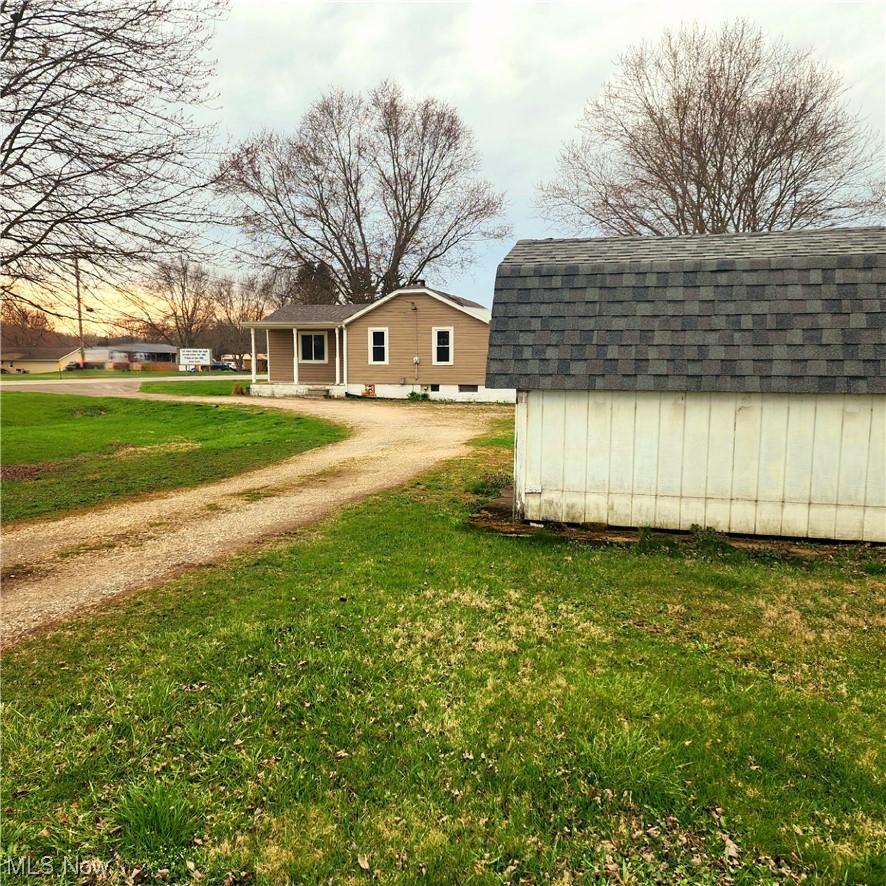 6923 Alliance Road Northwest Malvern, OH 44644 - Photo 6 of 24 Home and shed, showing U-shaped driveway