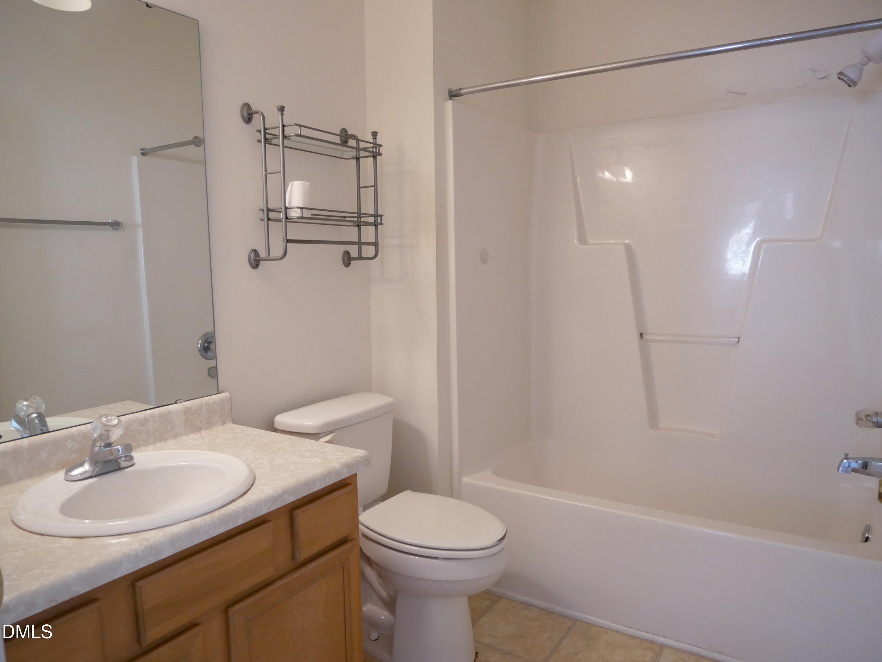 4400 Cottage Stone Drive Raleigh, NC 27616 - Photo 14 of 19 a bathroom with a sink toilet and shower