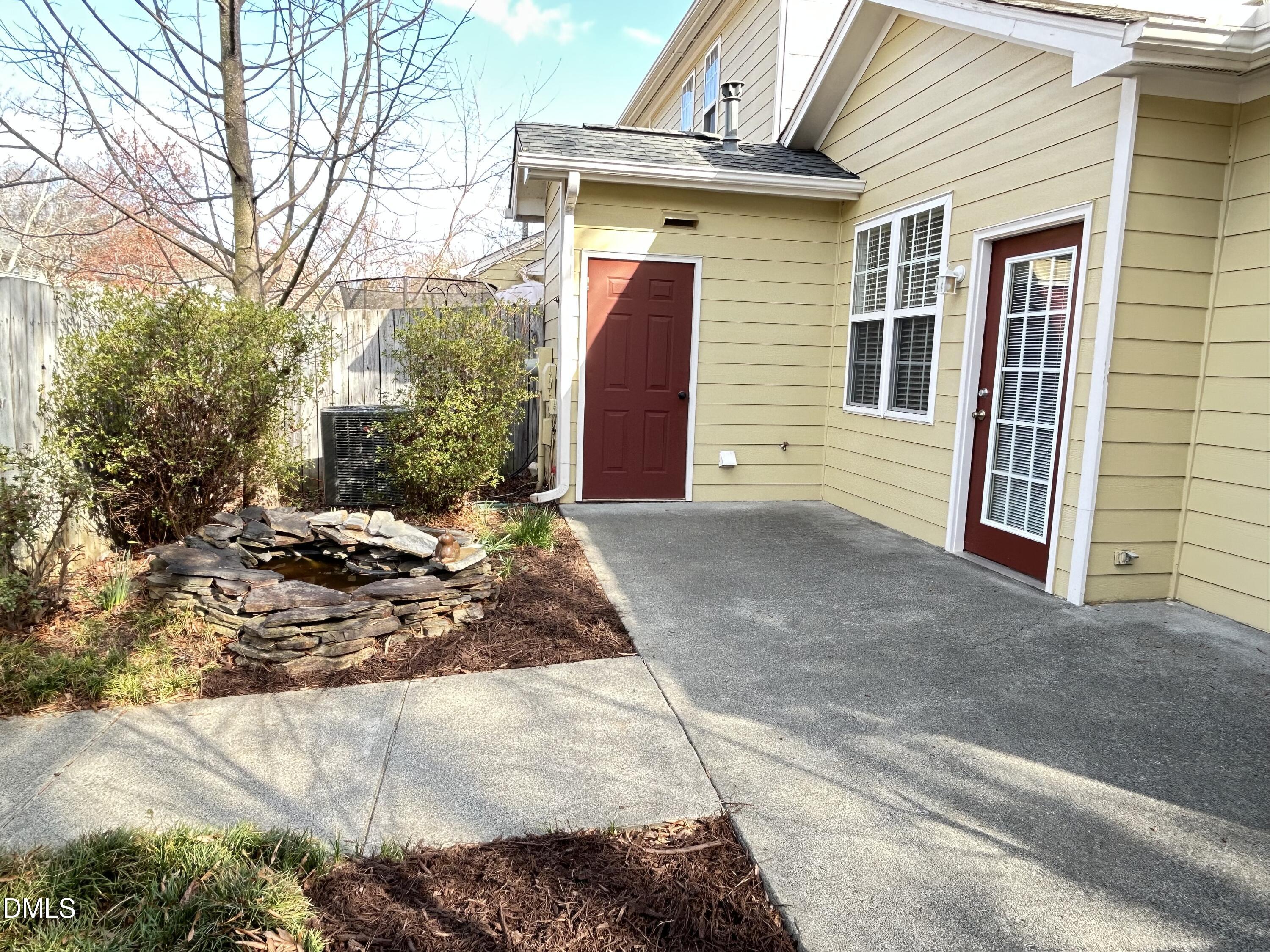 4400 Cottage Stone Drive Raleigh, NC 27616 - Photo 16 of 19 a view of a house with a yard and garage