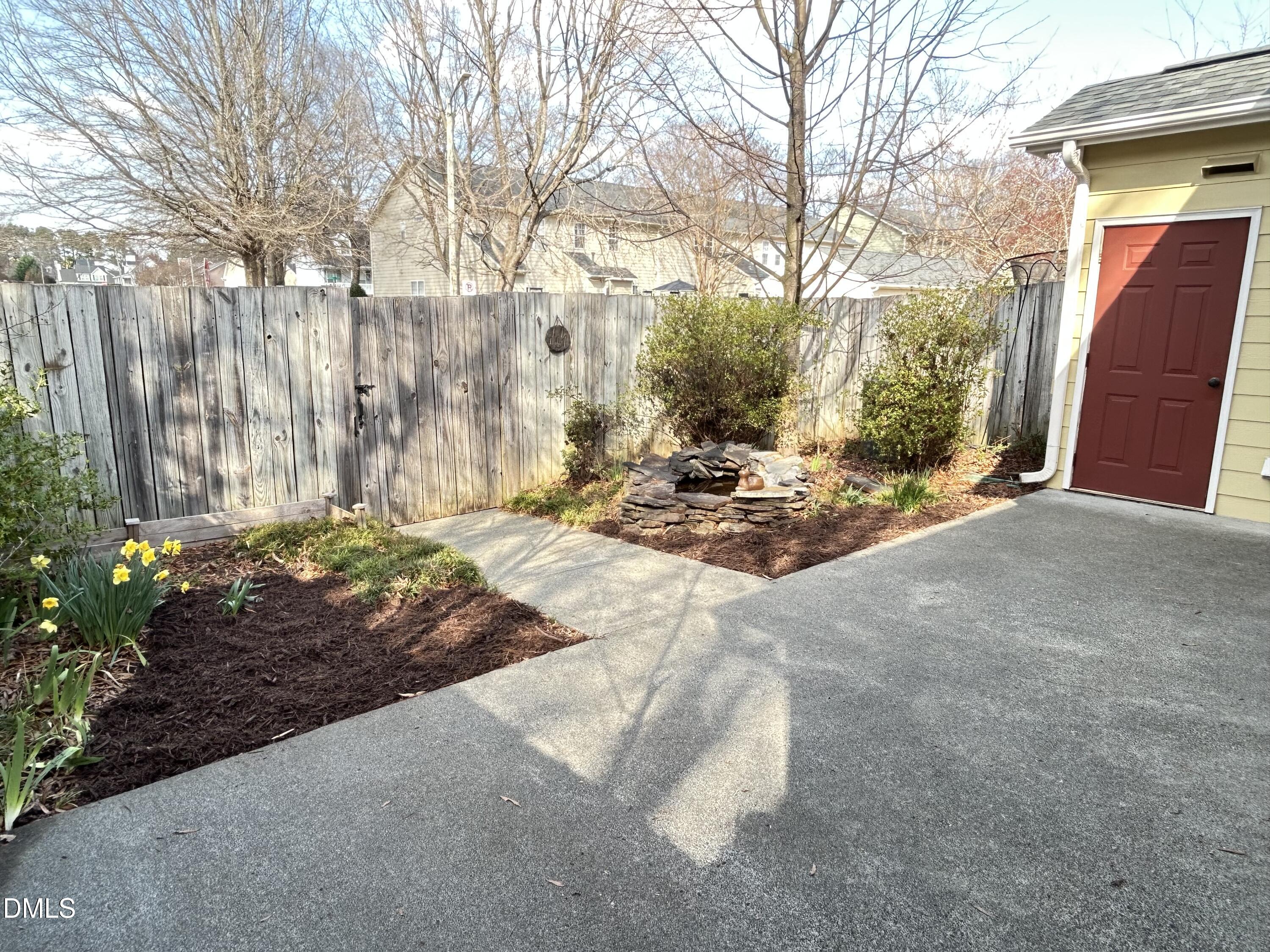 4400 Cottage Stone Drive Raleigh, NC 27616 - Photo 17 of 19 a backyard of a house with trees and outdoor space
