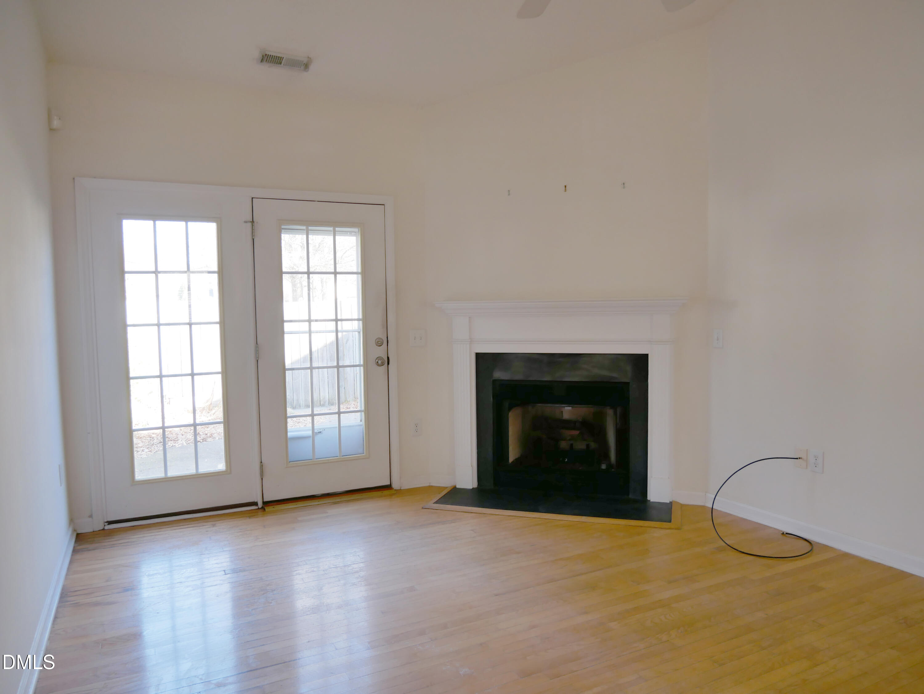 4400 Cottage Stone Drive Raleigh, NC 27616 - Photo 2 of 19 an empty room with windows and fireplace