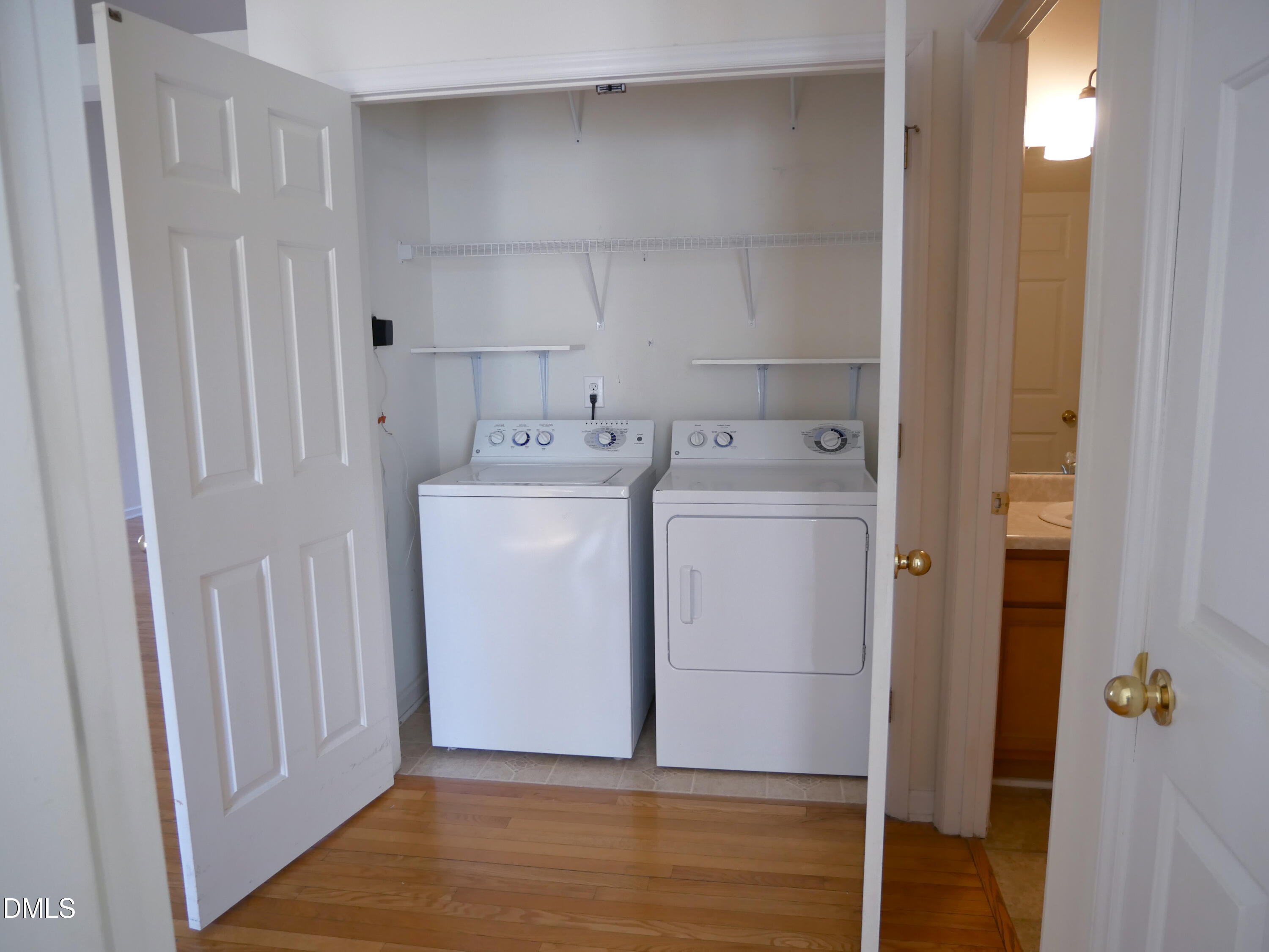4400 Cottage Stone Drive Raleigh, NC 27616 - Photo 8 of 19 a utility room with cabinets washer and dryer
