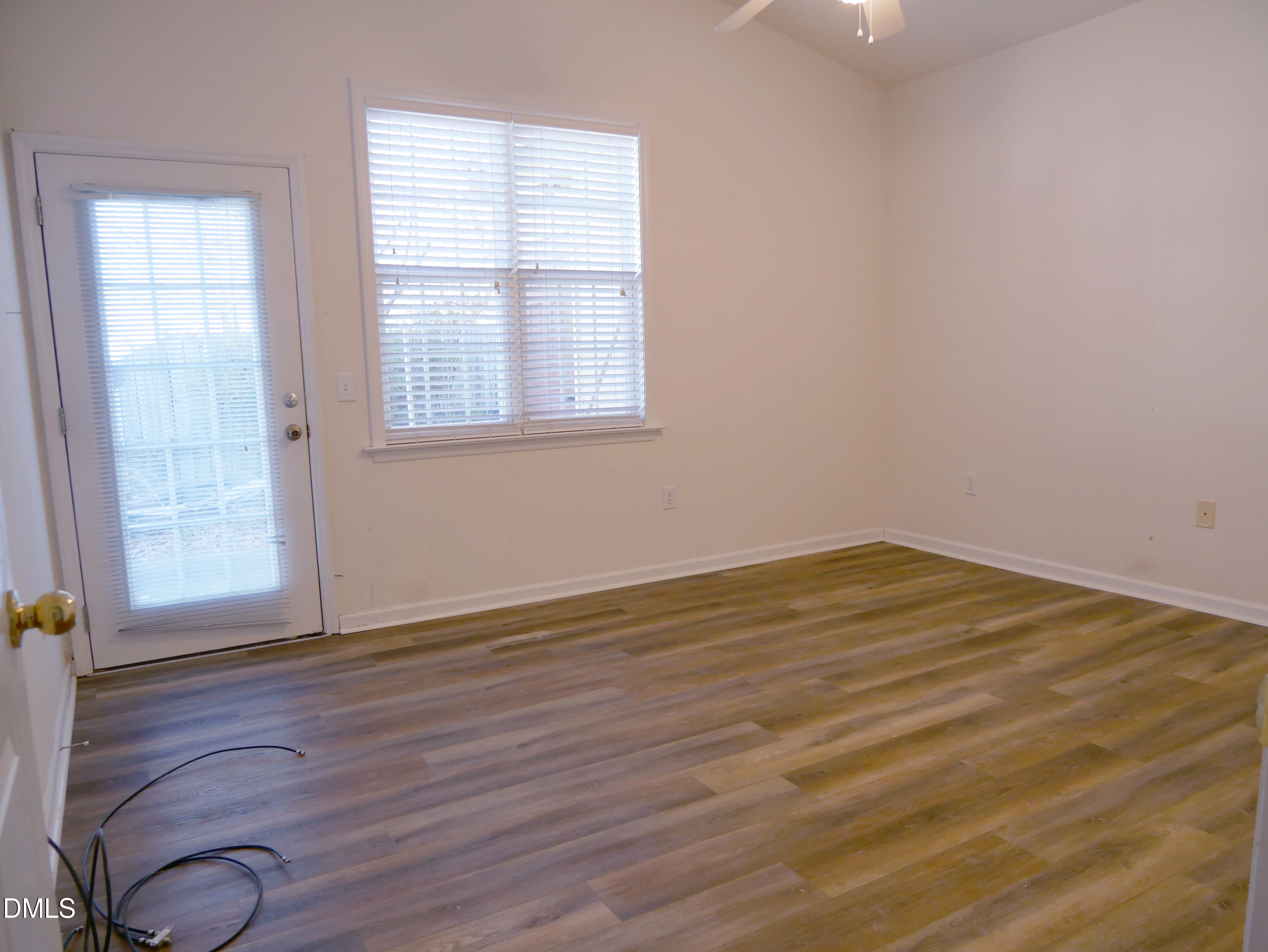 4400 Cottage Stone Drive Raleigh, NC 27616 - Photo 9 of 19 an empty room with wooden floor and windows