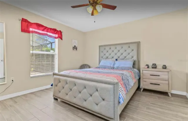 a bedroom with a bed and window