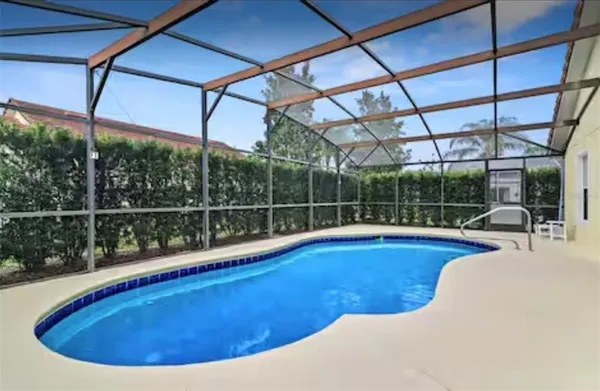 a view of a swimming pool with a porch