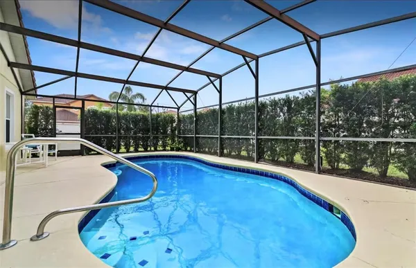 a view of a swimming pool with a porch