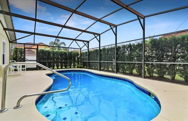 a view of a swimming pool with a porch