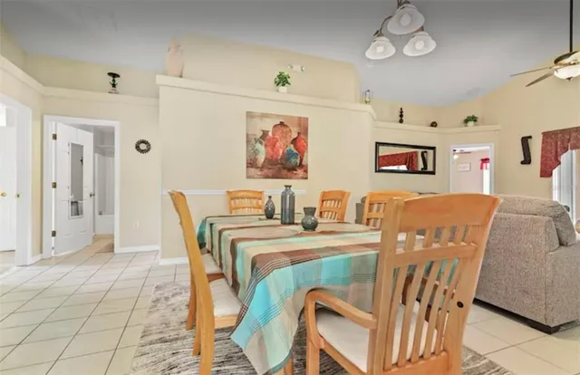 a dining room with furniture and window