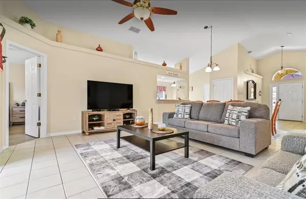 a living room with furniture and a flat screen tv