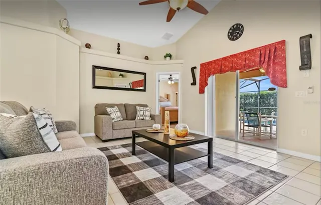 a living room with furniture and a rug