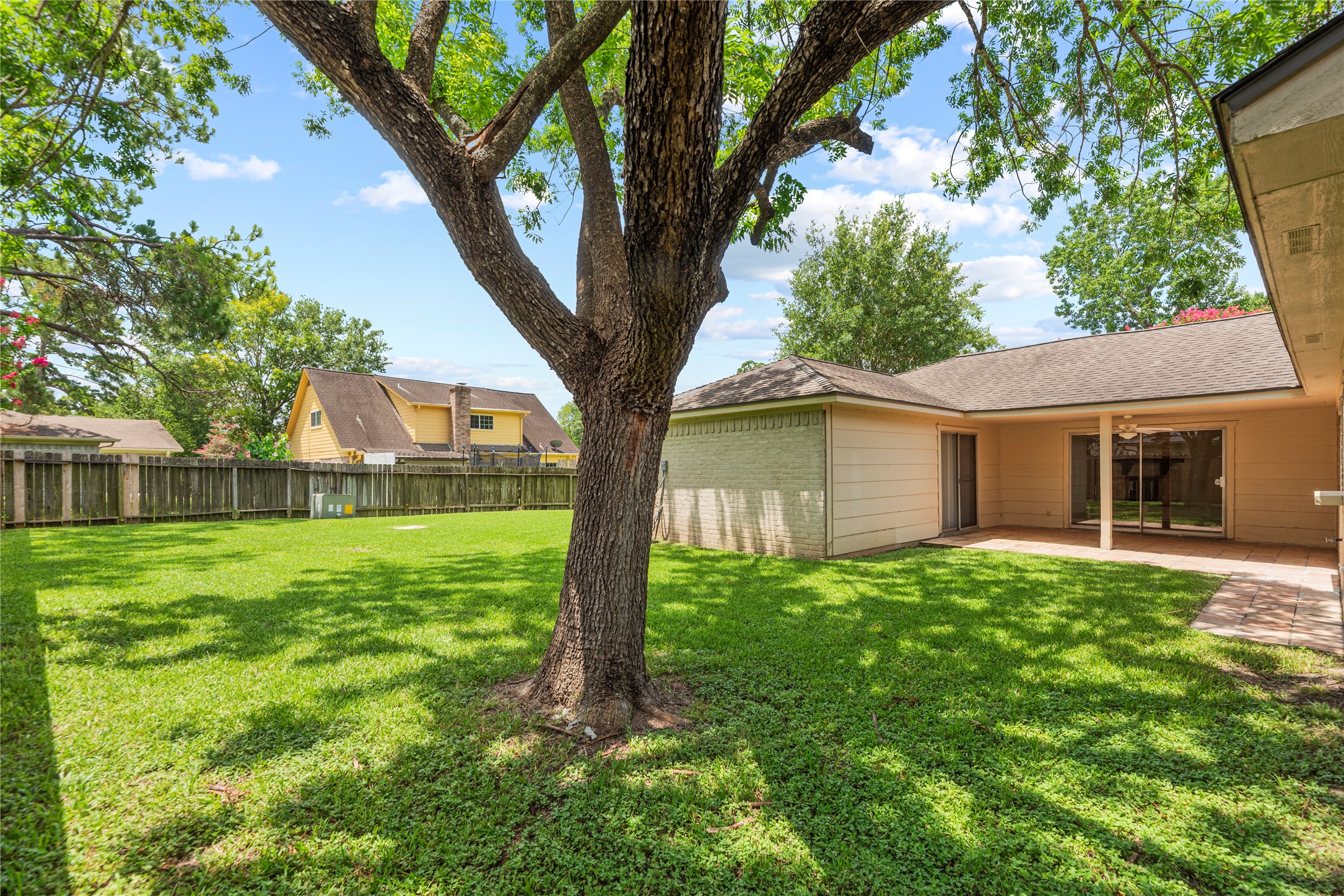 6931 Sandy Knolls Drive Spring, TX 77379 - Photo 19 of 21 Large backyard with mature trees offering shade and space to enjoy outdoor living.
**6931 Sandy Knolls Dr., Spring, TX 77379**