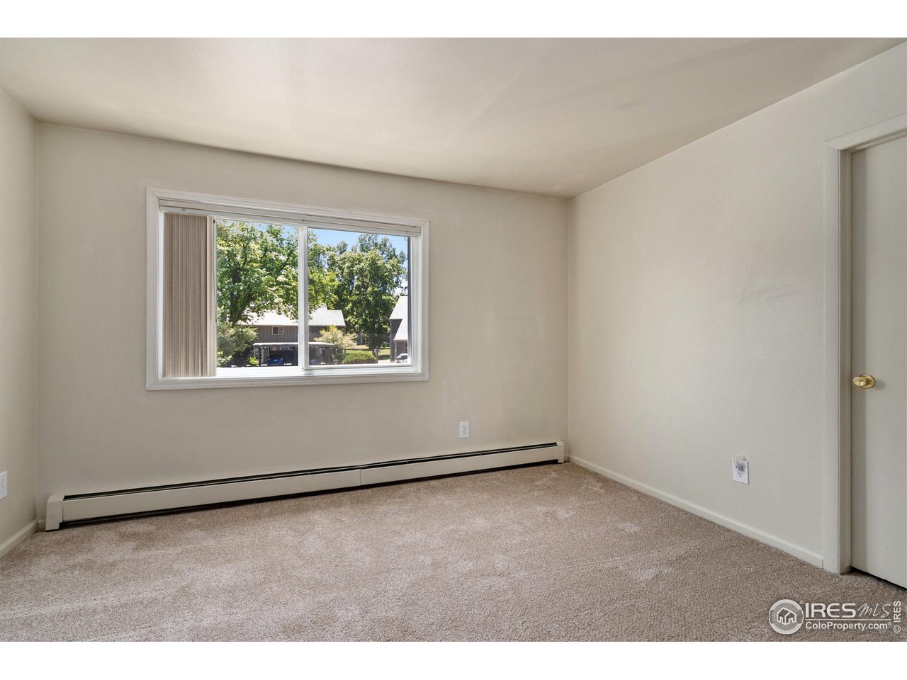 705 East Drake Road, Unit M 46 Fort Collins, CO 80525 - Photo 17 of 27 an empty room with a window