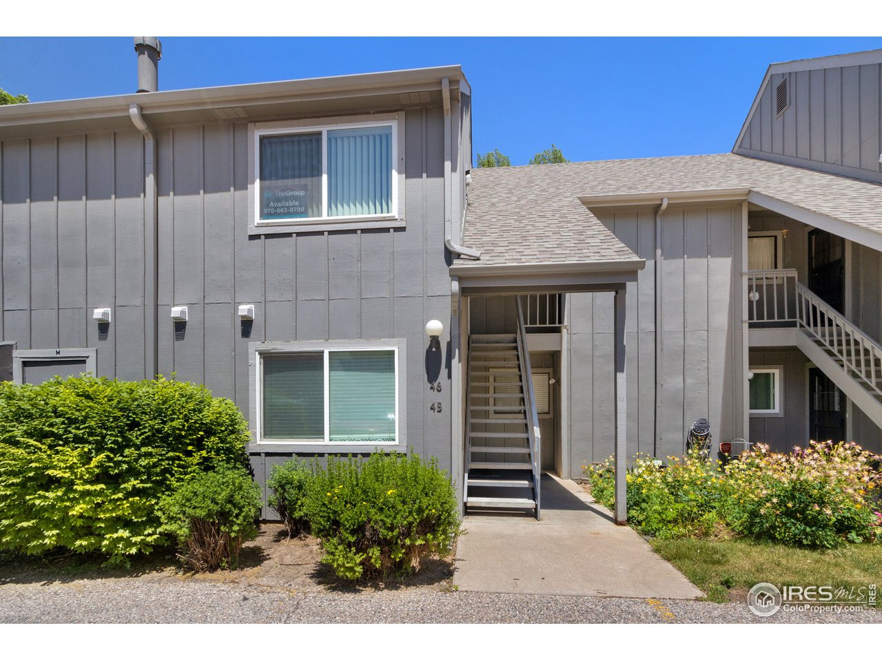 705 East Drake Road, Unit M 46 Fort Collins, CO 80525 - Photo 2 of 27 a front view of a house with garden