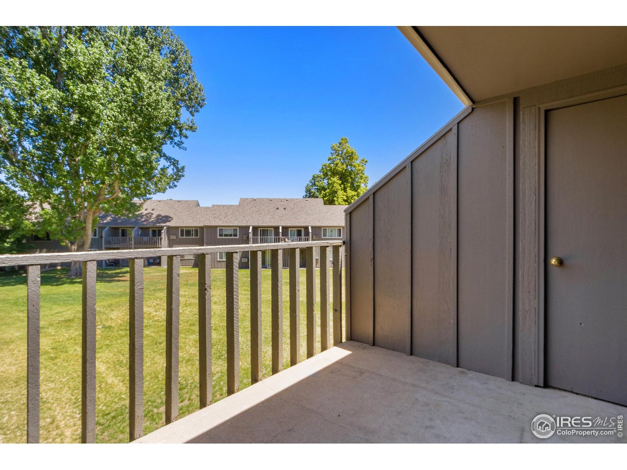 705 East Drake Road, Unit M 46 Fort Collins, CO 80525 - Photo 23 of 27 a porch with a table in front of it