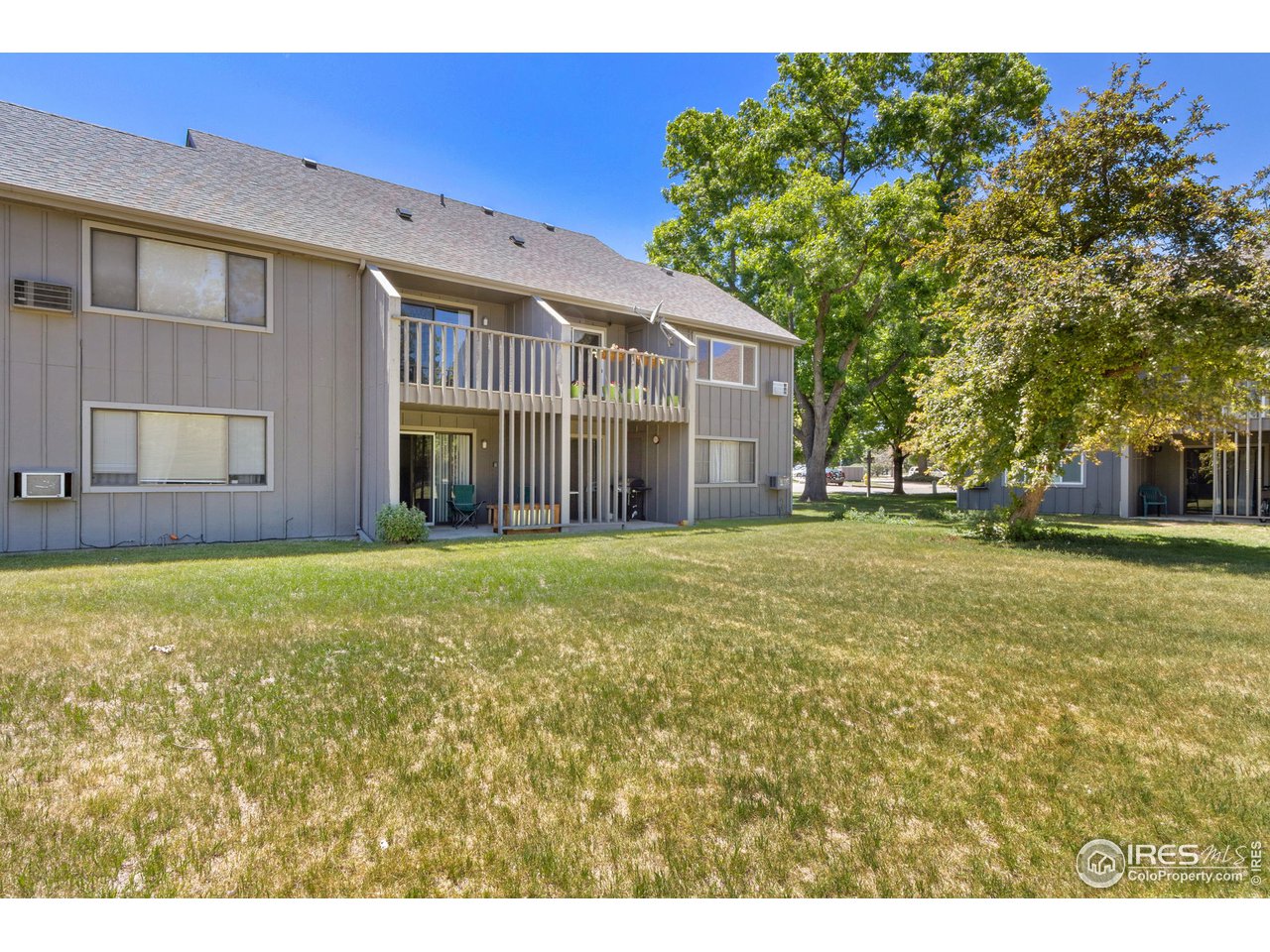 705 East Drake Road, Unit M 46 Fort Collins, CO 80525 - Photo 25 of 27 a view of a house with a yard