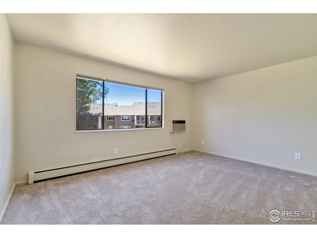 705 East Drake Road, Unit M 46 Fort Collins, CO 80525 - Photo 6 of 27 an empty room with windows