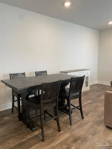 a view of a dinning table and chairs in patio